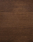 A close-up image of a wood surface with a medium brown stain applied to it, showcasing the texture and color of the finish.