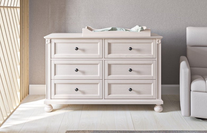 Dakota white solid wood double dresser with changing tray in a nursery