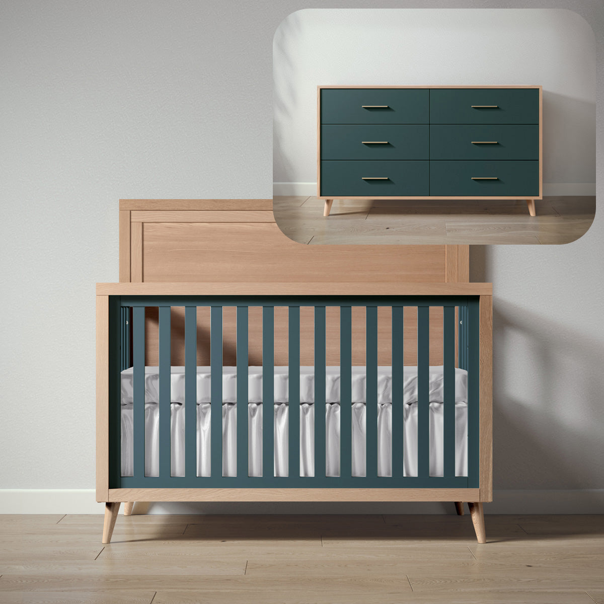 Wooden crib with green and white bedding next to a matching dresser in a minimalistic room.